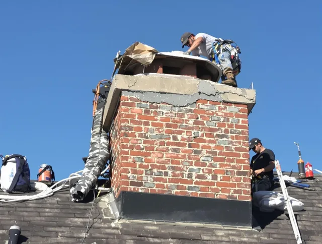 Menifee Chimney Sweep installing a custom chimney crown in Menifee, CA