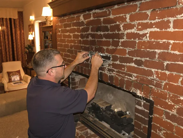Menifee Chimney Sweep expert fixing a fireplace in Menifee, CA